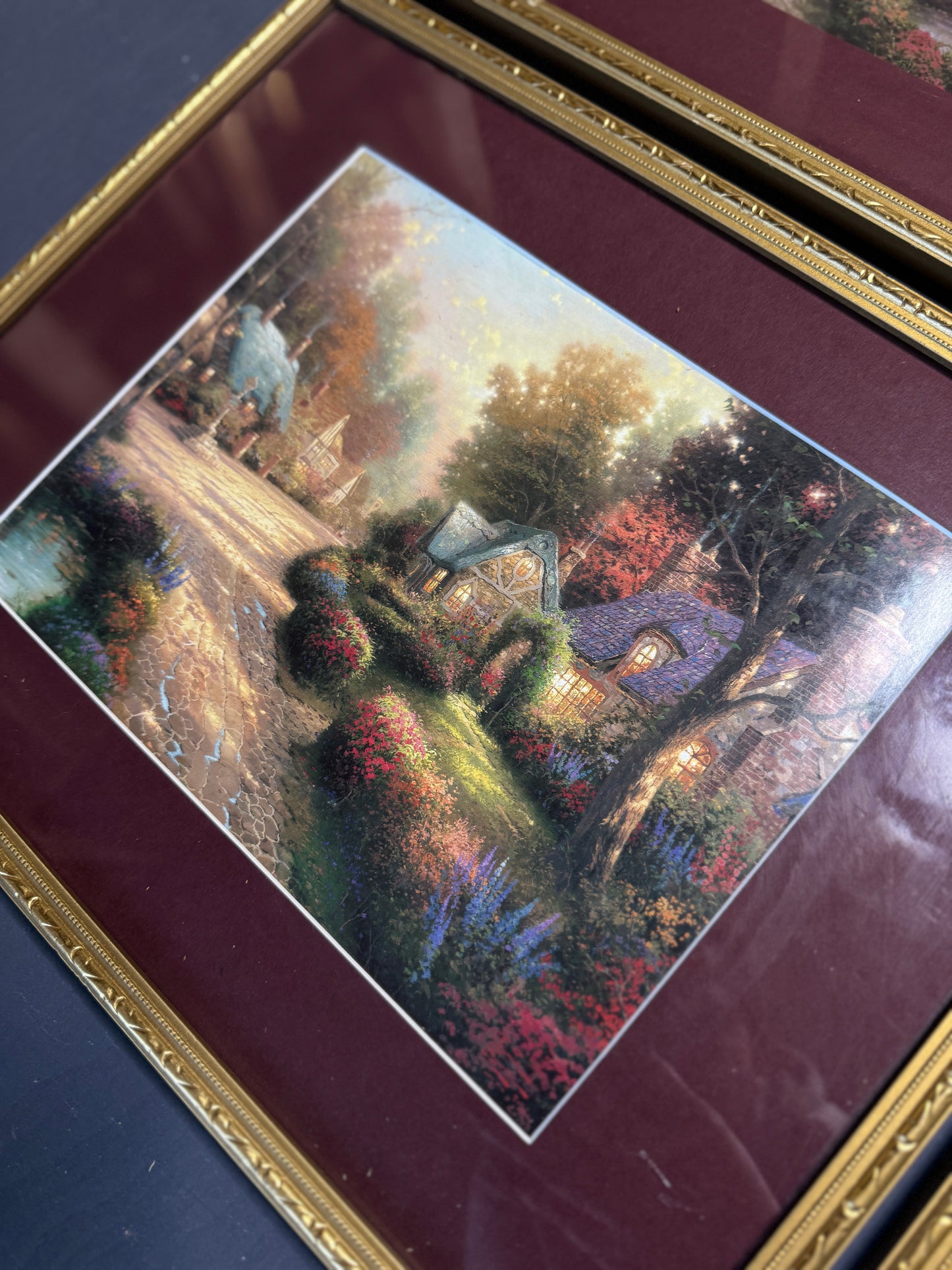 Thomas Kinkade – Framed Print Gallery Wall Set with Burgundy Mount in Gold Frame